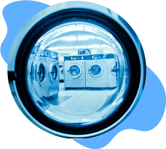 A reflection of two washing machines in the mirror.